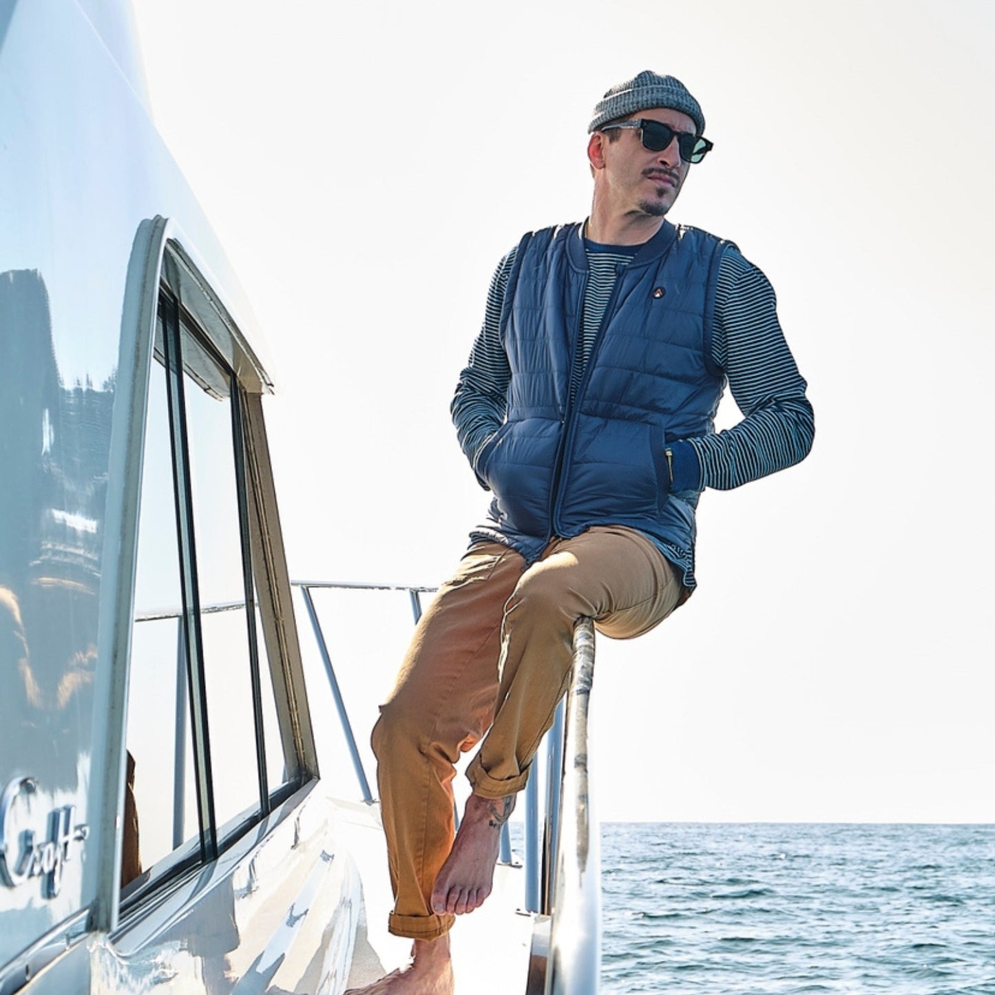 Lifestyle shot of a navy blue down vest that showcases the texture and warmth.