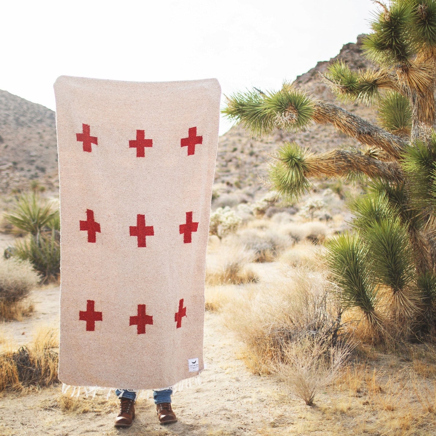 Handwoven throw blanket with intricate patterns, showcasing its cozy texture and warm colors.