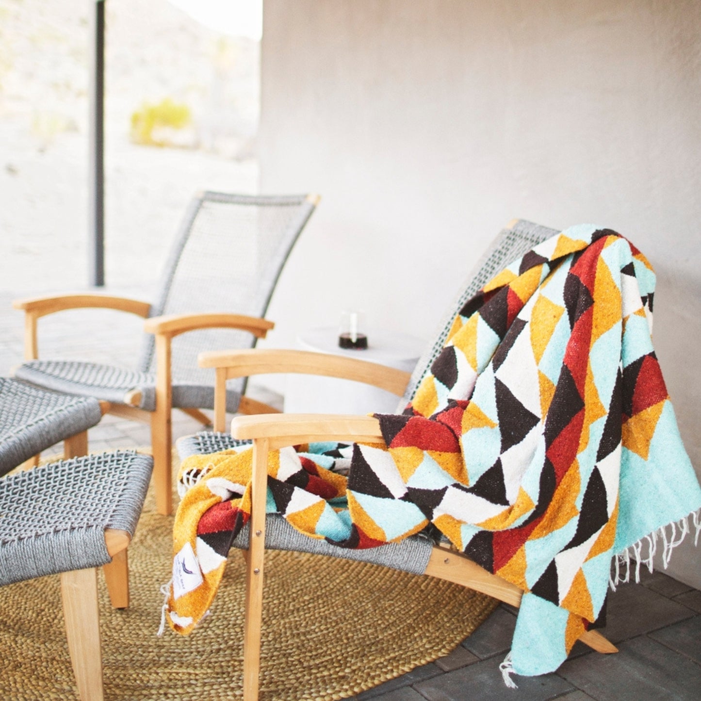 Handwoven throw blanket with intricate patterns, showcasing its cozy texture and warm colors.