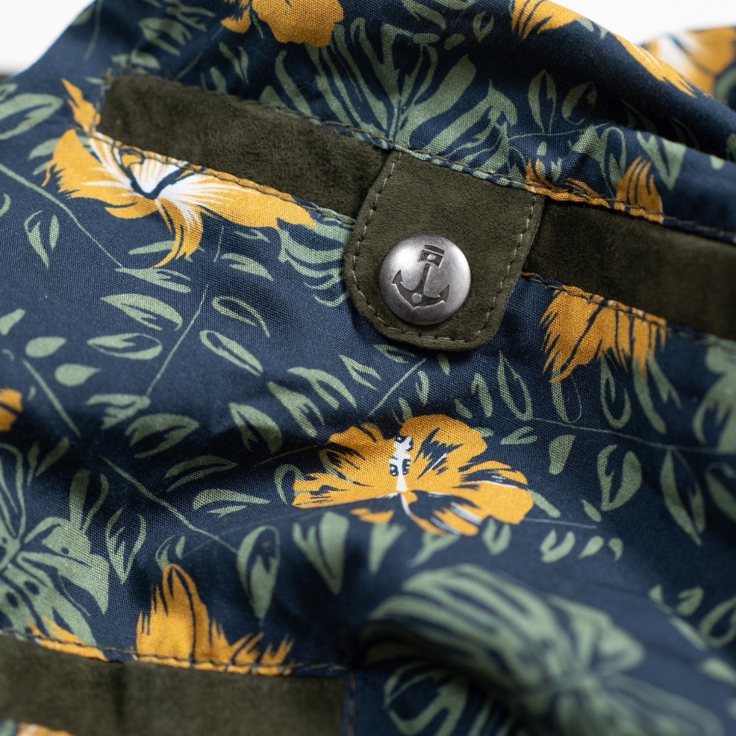 Luxuriously soft goat suede bomber jacket with custom cotton poplin liner, two exterior side welt pockets for warmth, and vintage-inspired details for a classic look.