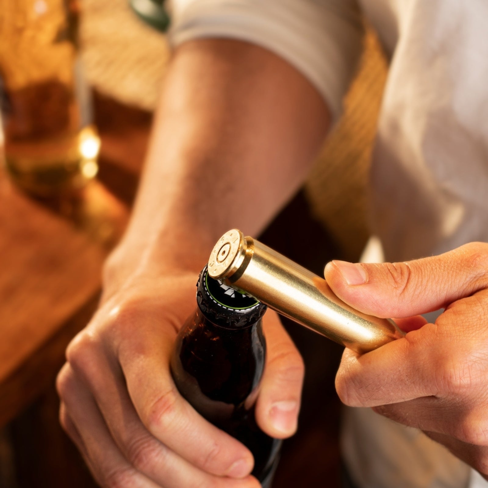 Bottle opener crafted from an authentic 50 cal casing, showcasing a rugged, military-inspired design for opening bottles with a unique, durable touch.