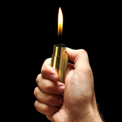 Unique 50 cal refillable brass lighter designed to resemble a bullet, featuring a durable, rugged finish and a convenient, practical design for lighting.