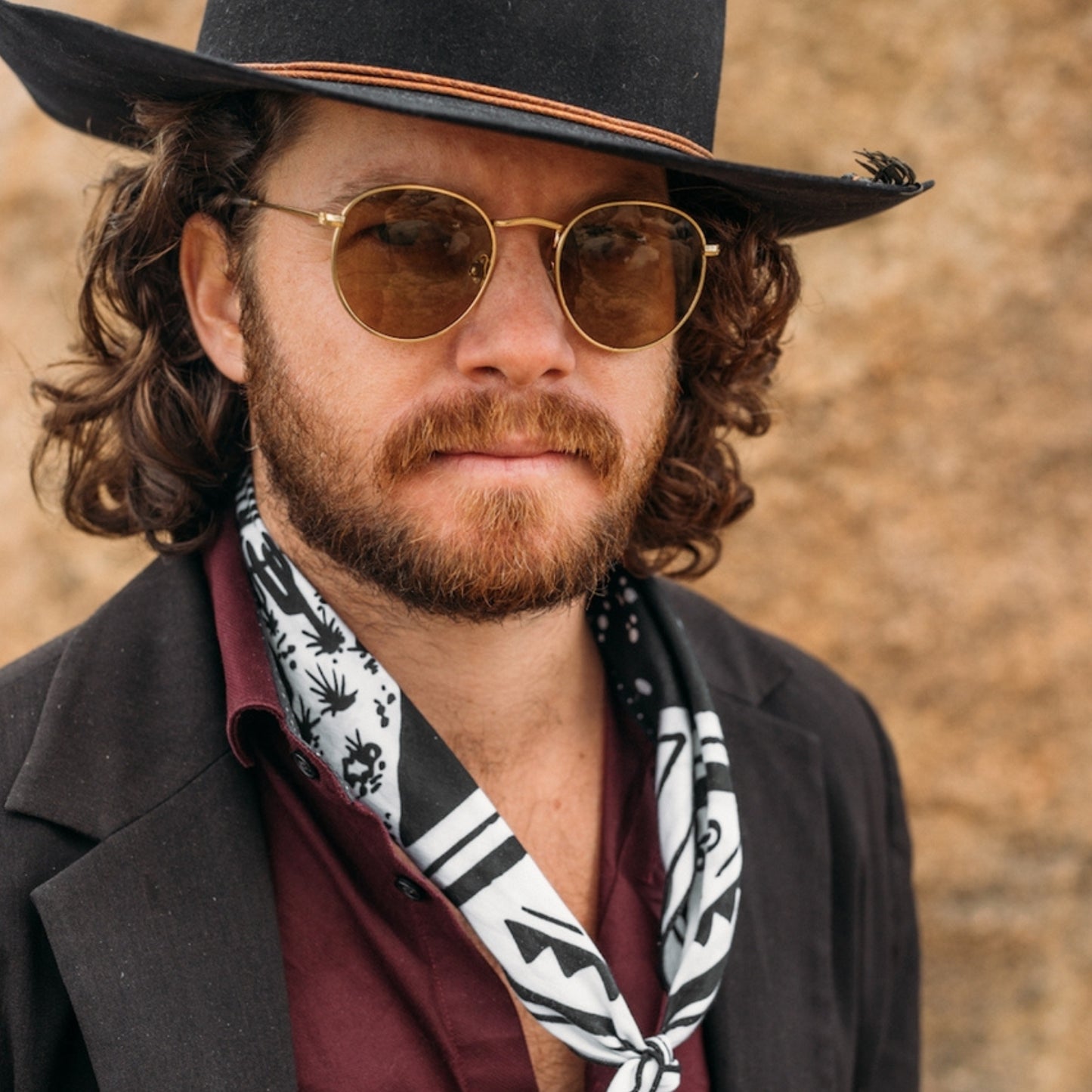 Black and white 100% organic cotton bandana with a western vintage design.