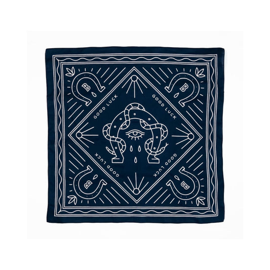 Navy-colored 100% organic cotton bandana featuring a vintage horseshoe design, a timeless accessory with rustic charm.