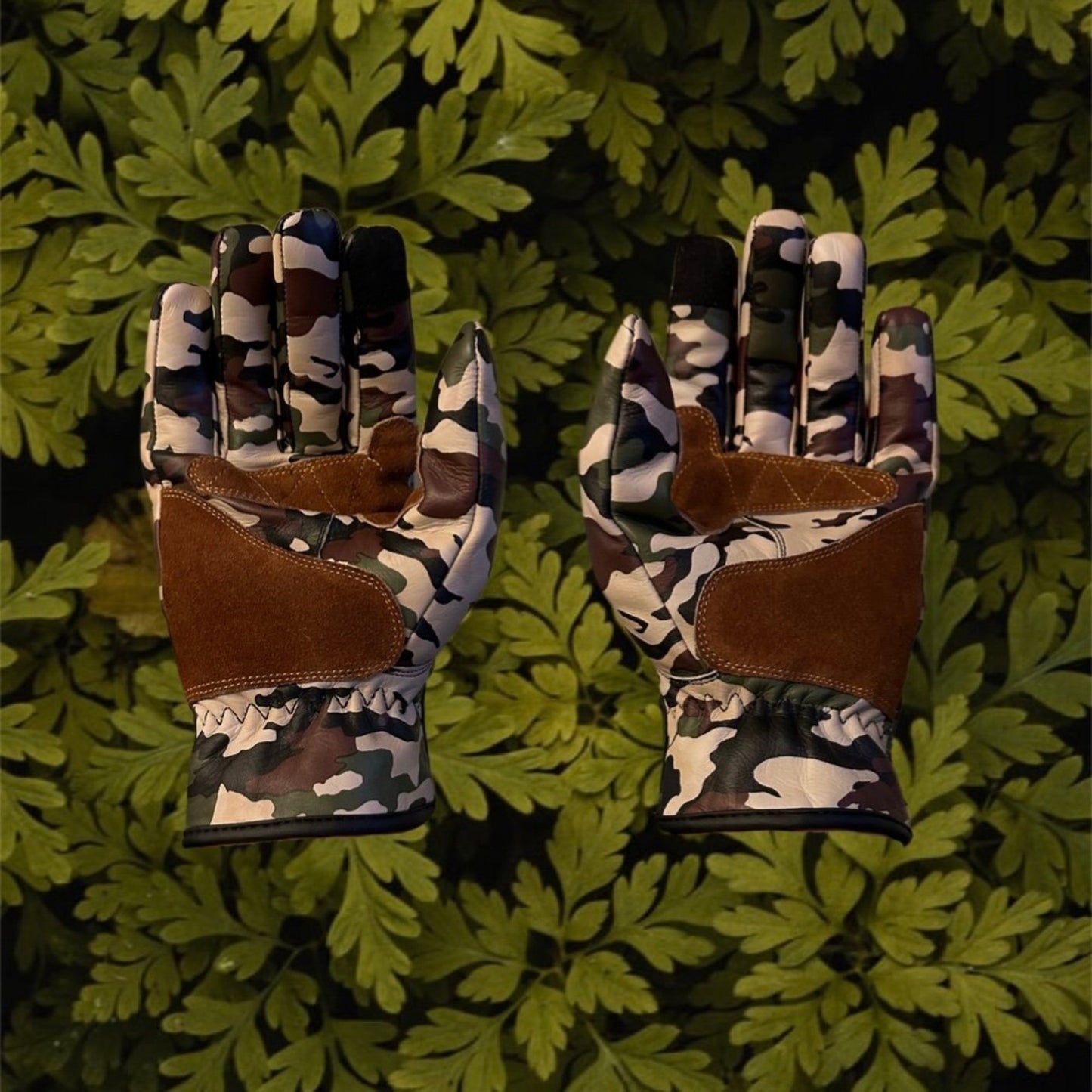 Jungle camouflage motorcycle gloves for street riding and protective gear.