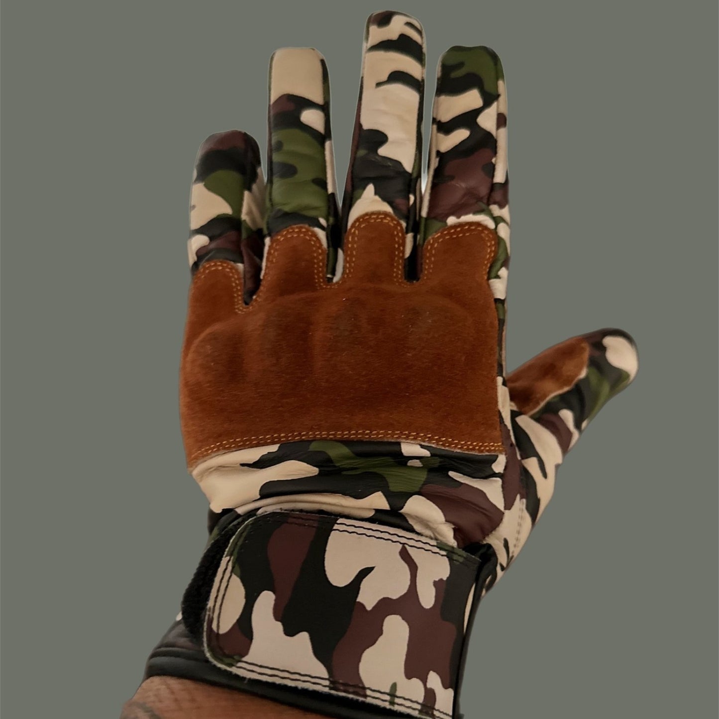 Jungle camouflage motorcycle gloves for street riding and protective gear.
