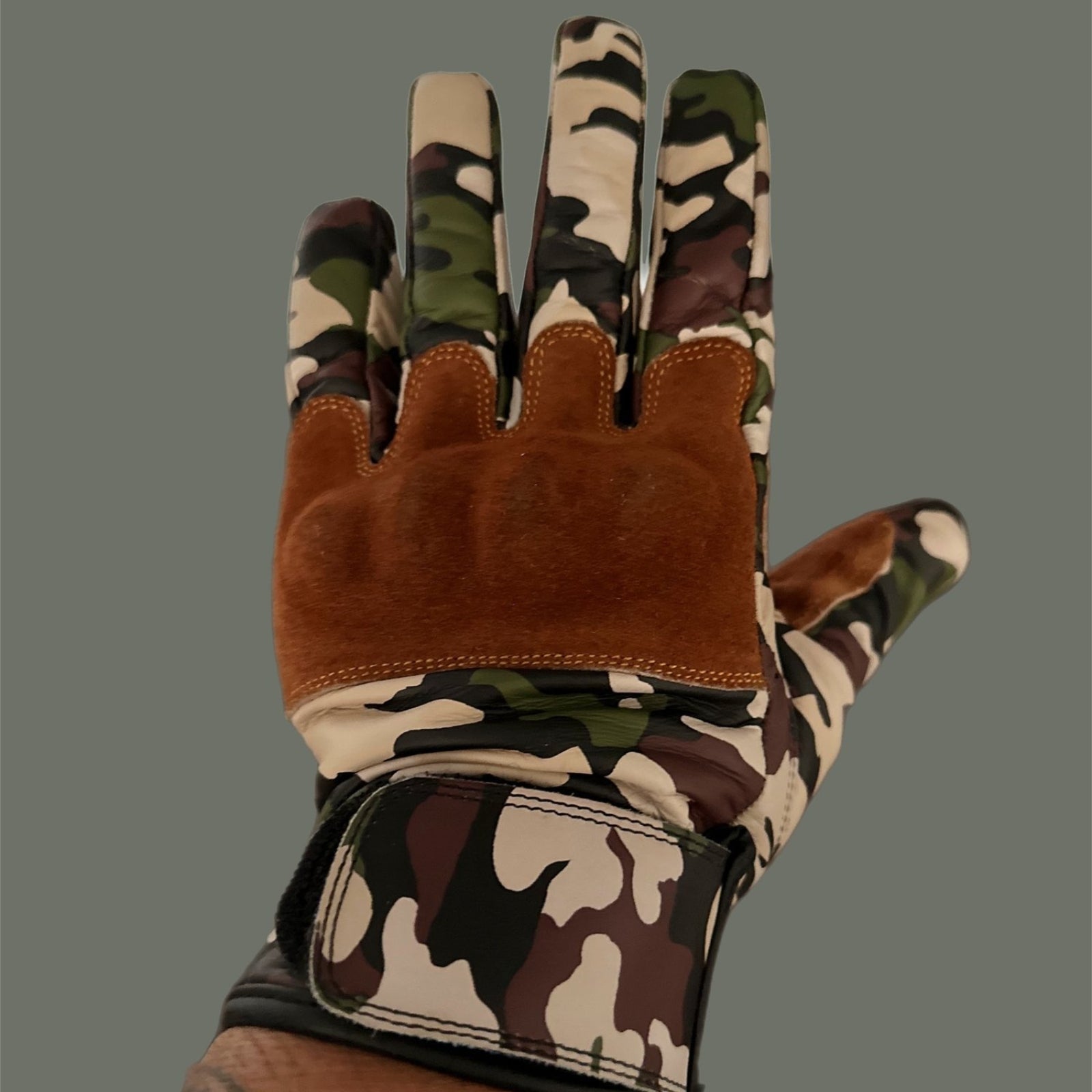 Jungle camouflage motorcycle gloves for street riding and protective gear.