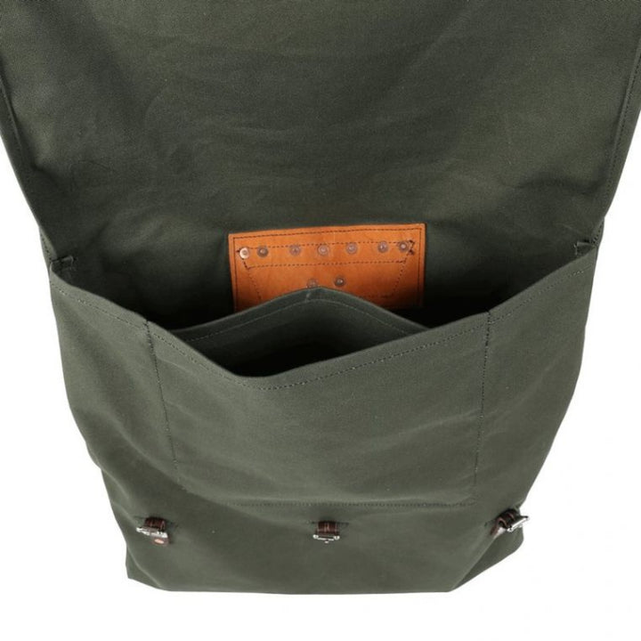 Inside look of a rugged, durable camp backpack made in the USA, designed for outdoor adventures with and multiple compartments for gear.