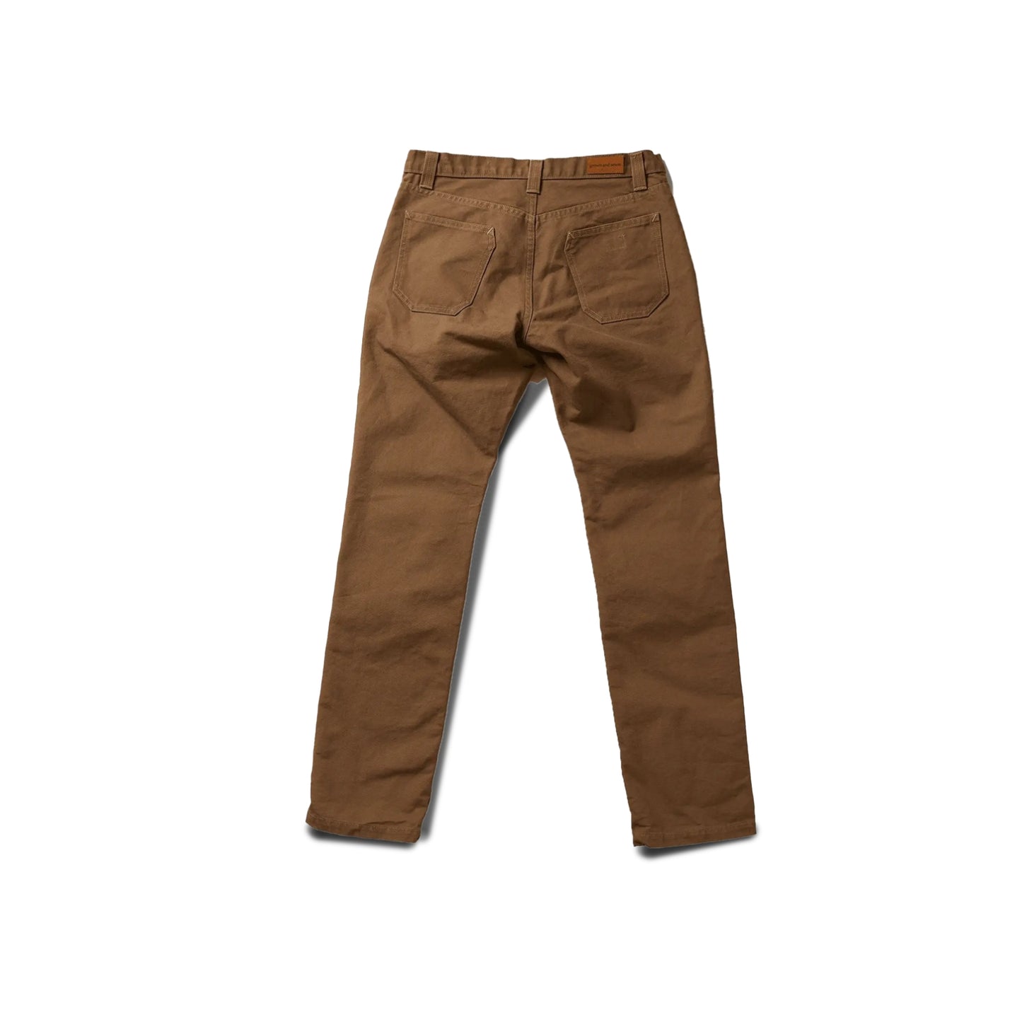 Durable brown colored canvas pants with a timeless classic design, offering a structured fit that fades over time like denim for a unique, worn-in look.