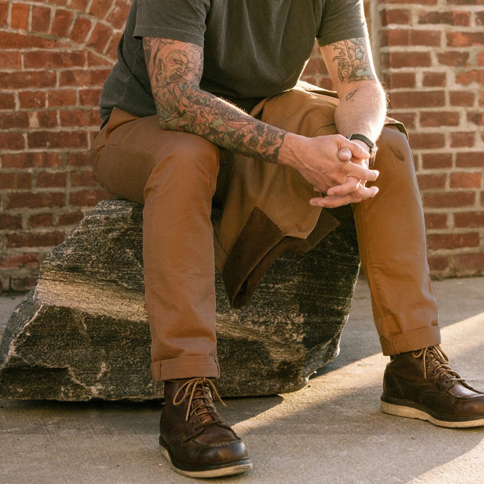 Durable brown colored canvas pants with a timeless classic design, offering a structured fit that fades over time like denim for a unique, worn-in look.
