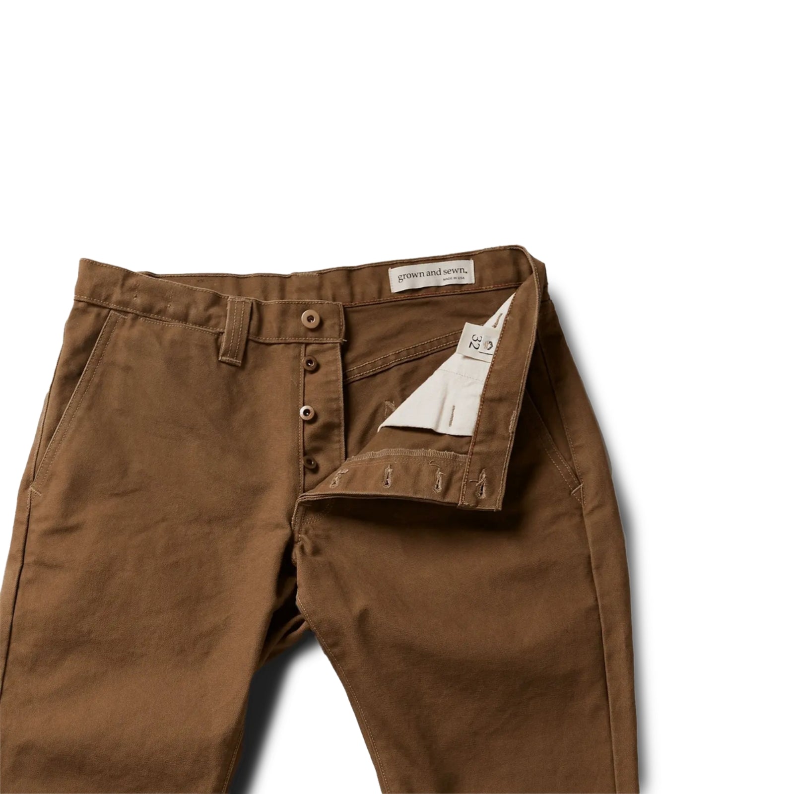 Durable brown colored canvas pants with a timeless classic design, offering a structured fit that fades over time like denim for a unique, worn-in look.