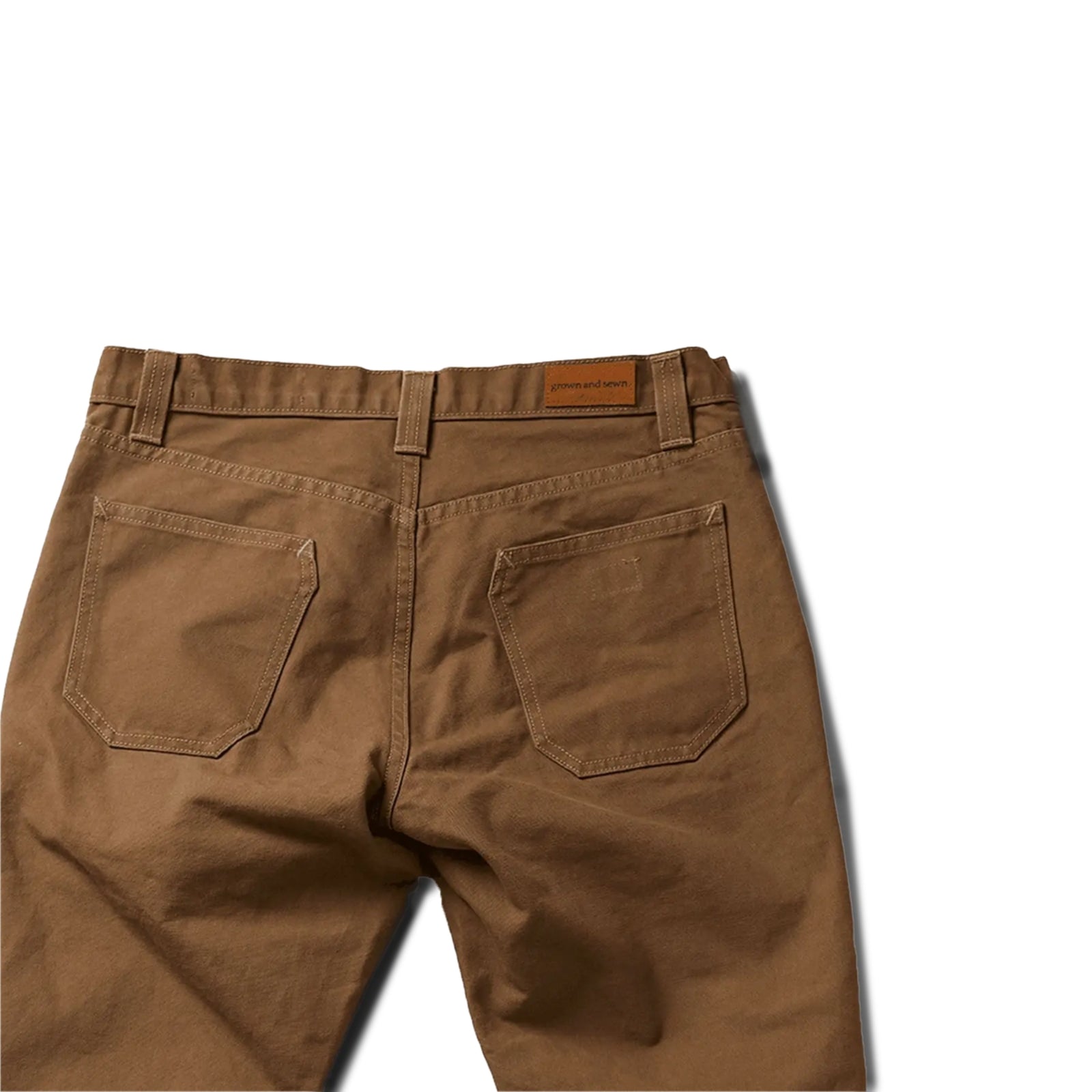 Durable brown colored canvas pants with a timeless classic design, offering a structured fit that fades over time like denim for a unique, worn-in look.