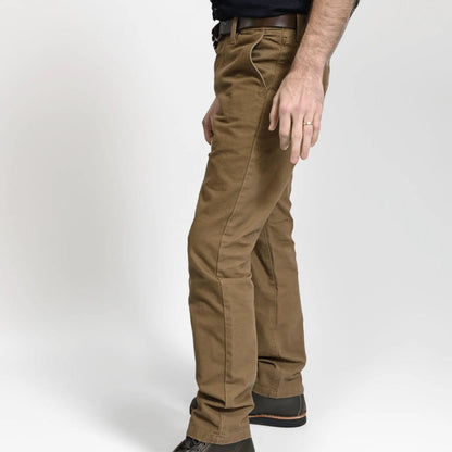 Durable brown colored canvas pants with a timeless classic design, offering a structured fit that fades over time like denim for a unique, worn-in look.