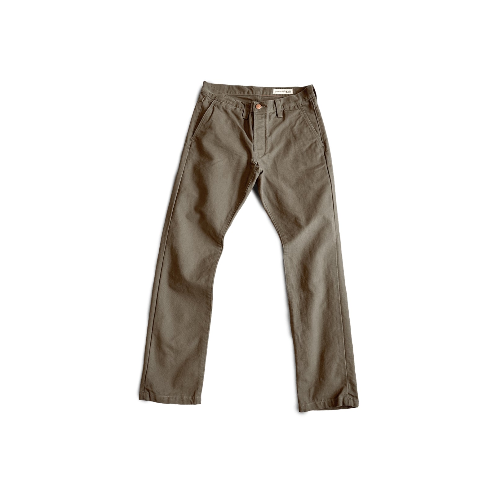 Durable green colored canvas pants with a timeless classic design, offering a structured fit that fades over time like denim for a unique, worn-in look.