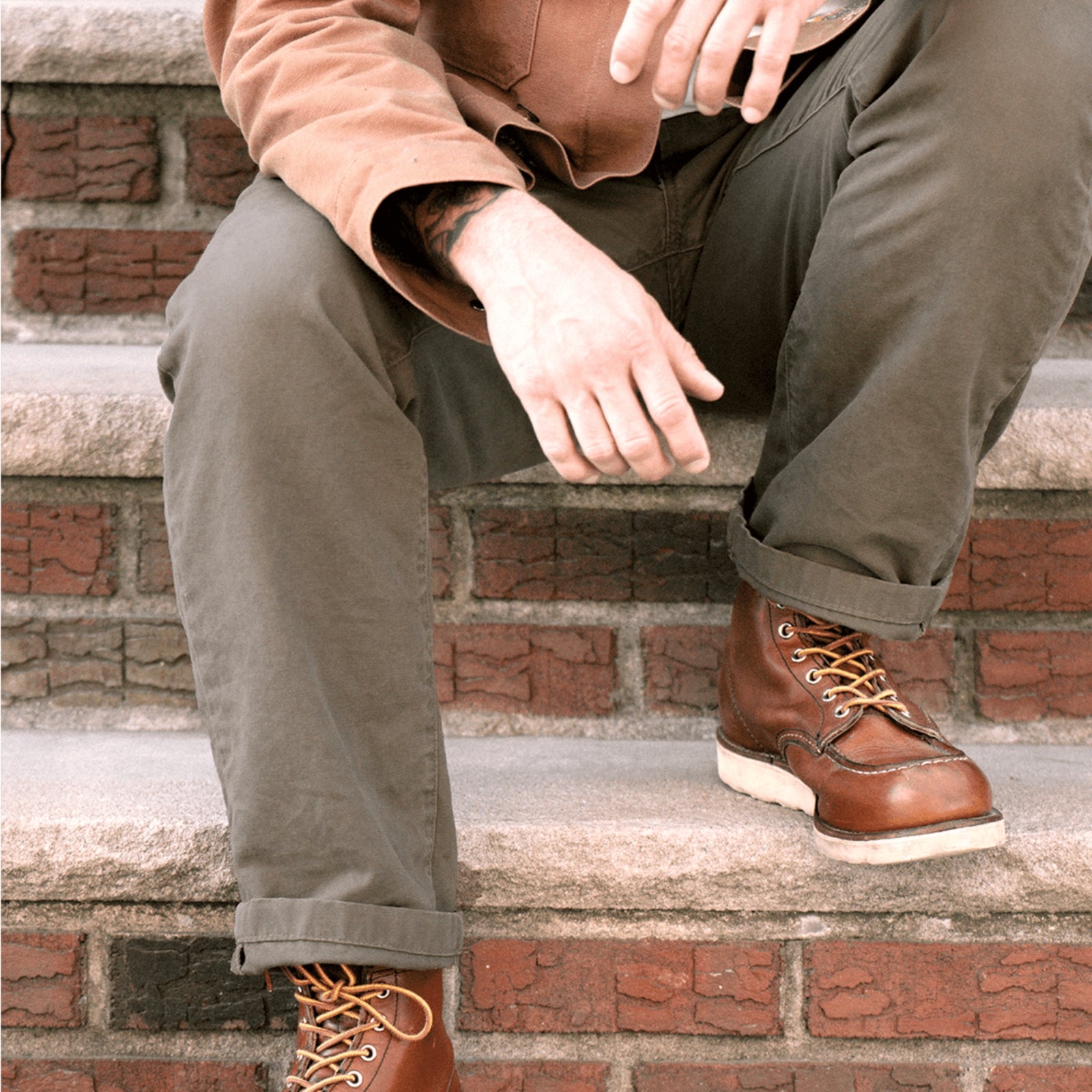 Durable green colored canvas pants with a timeless classic design, offering a structured fit that fades over time like denim for a unique, worn-in look.