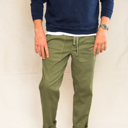 Men's green cargo pants with multiple pockets and a relaxed fit.