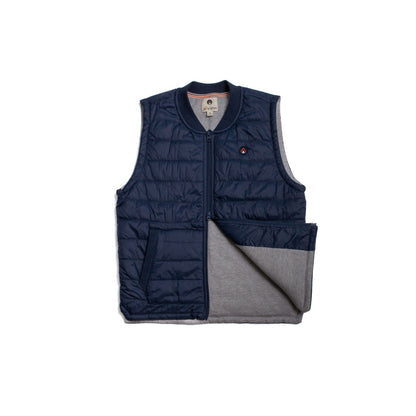 Close-up of a navy blue down vest that showcases the texture and insulation.