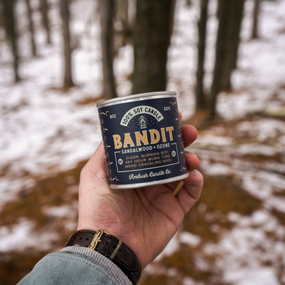 100% eco-friendly, vegan, and recyclable rugged candle with a sandalwood, ozone, and leather scent, featuring sustainable packaging.