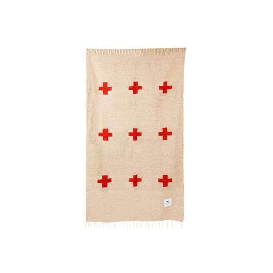 Handwoven throw blanket with intricate patterns, showcasing its cozy texture and warm colors.