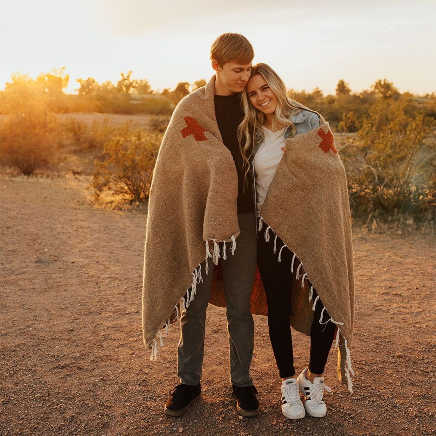Handwoven throw blanket with intricate patterns, showcasing its cozy texture and warm colors.