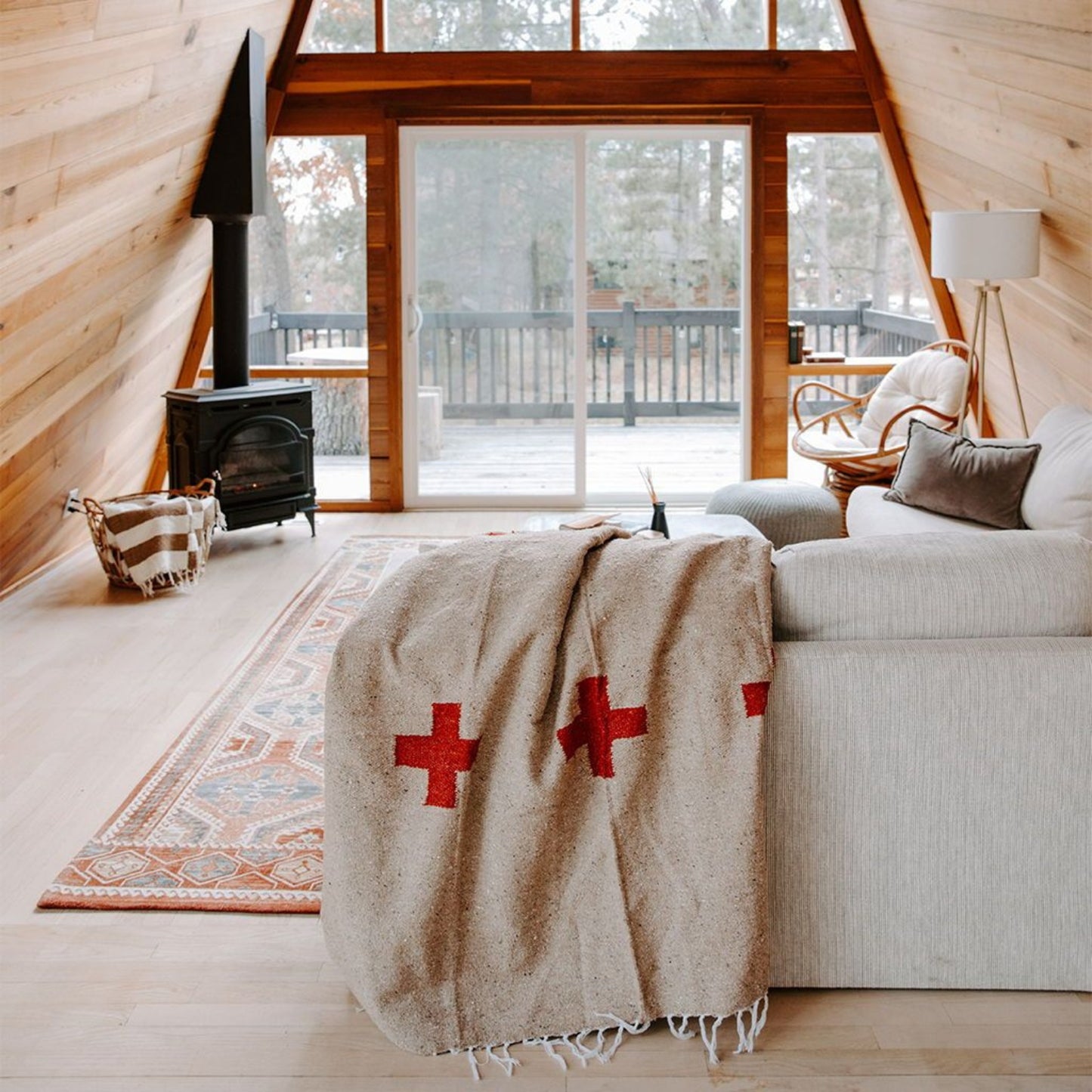 Handwoven throw blanket with intricate patterns, showcasing its cozy texture and warm colors.