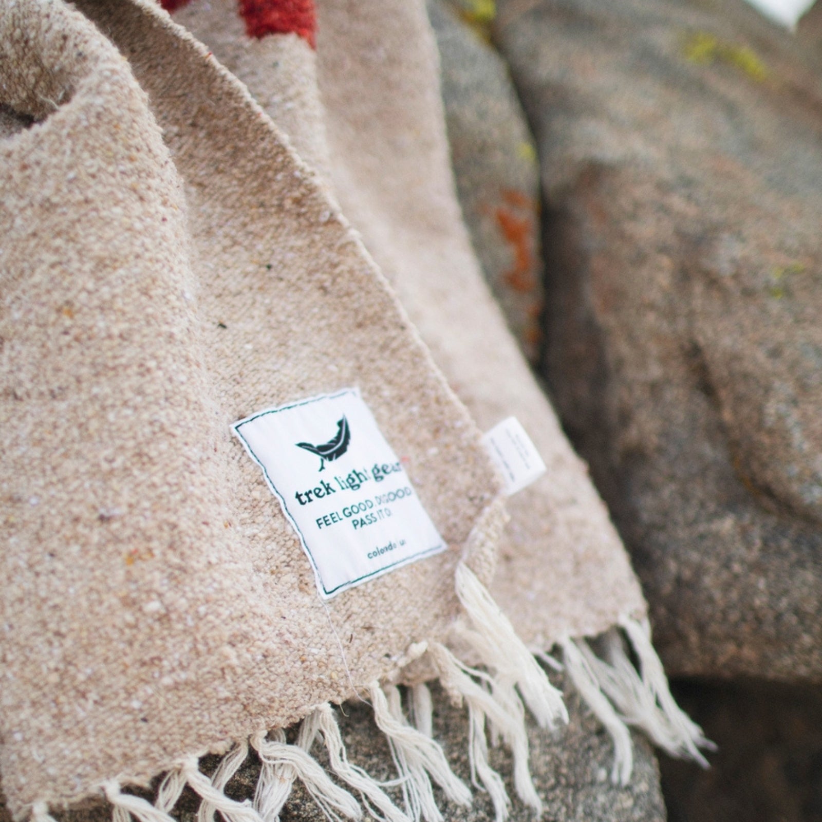 Handwoven throw blanket with intricate patterns, showcasing its cozy texture and warm colors.