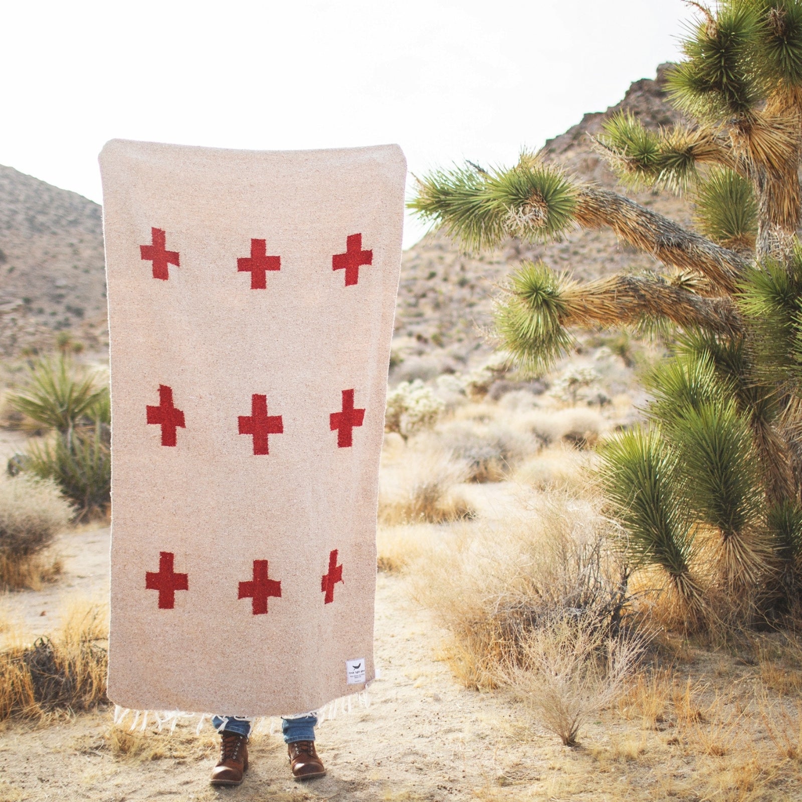 Handwoven throw blanket with intricate patterns, showcasing its cozy texture and warm colors.