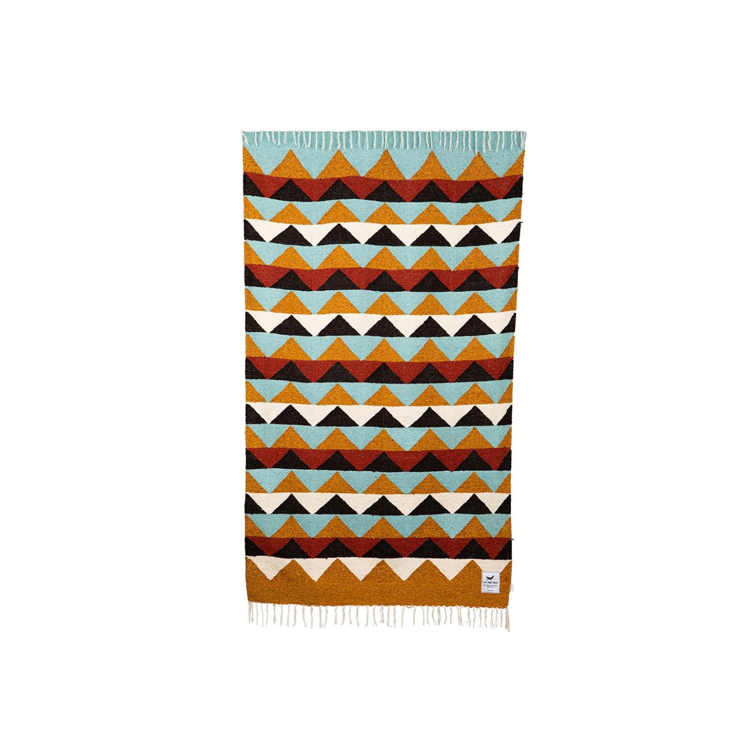 Handwoven throw blanket with intricate patterns, showcasing its cozy texture and warm colors.