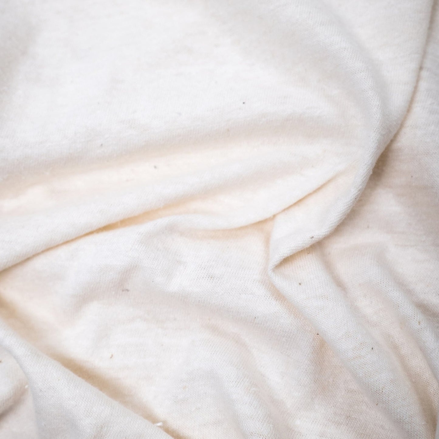 Organic hemp t-shirt in natural color, showcasing a soft, eco-friendly fabric with a relaxed fit.