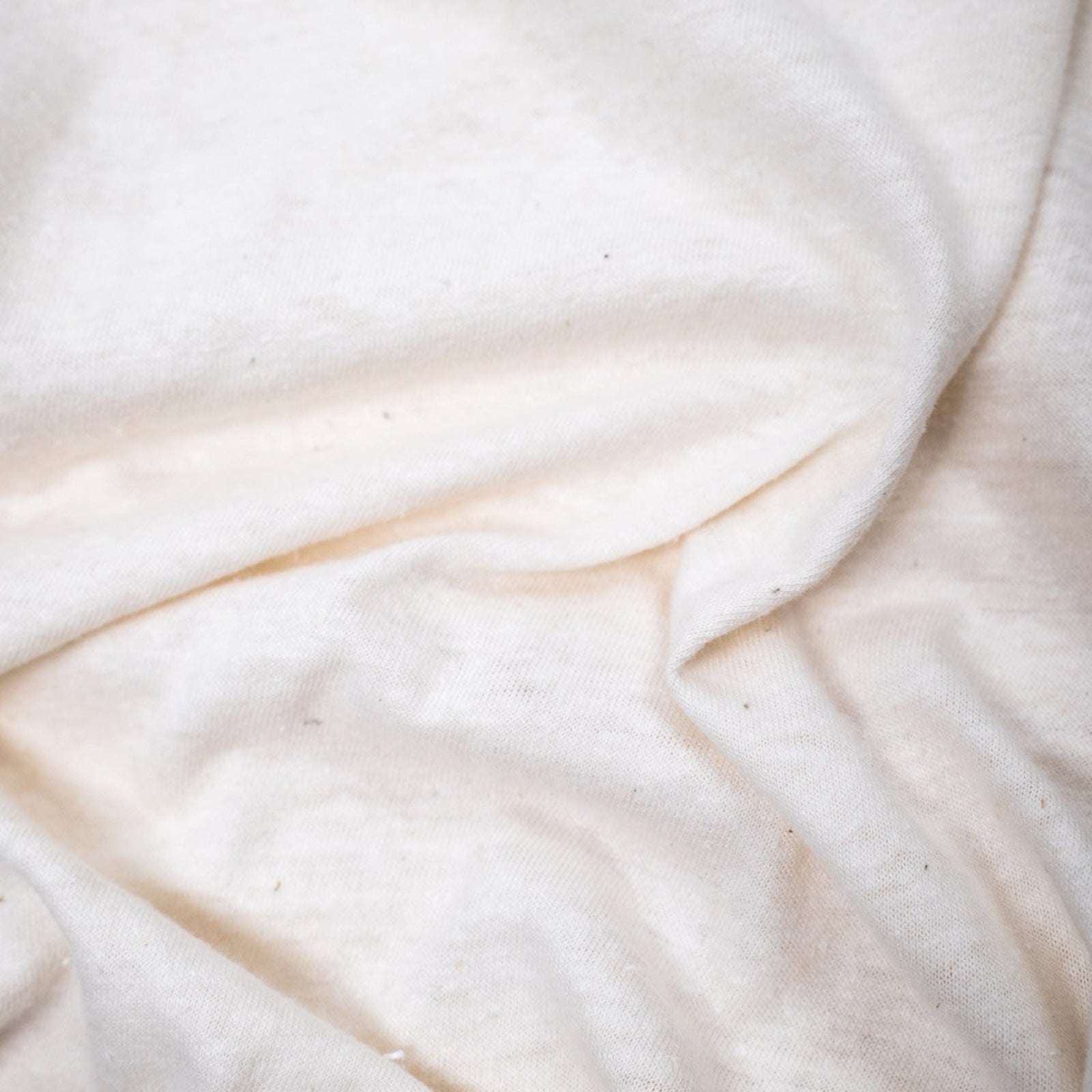 Organic hemp t-shirt in natural color, showcasing a soft, eco-friendly fabric with a relaxed fit.