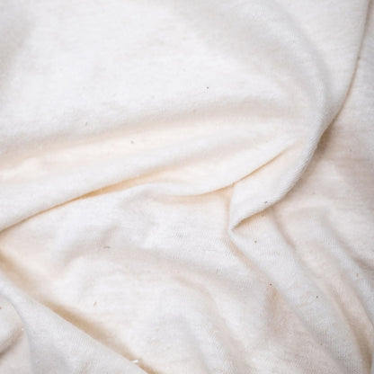 Organic hemp t-shirt in natural color, showcasing a soft, eco-friendly fabric with a relaxed fit.