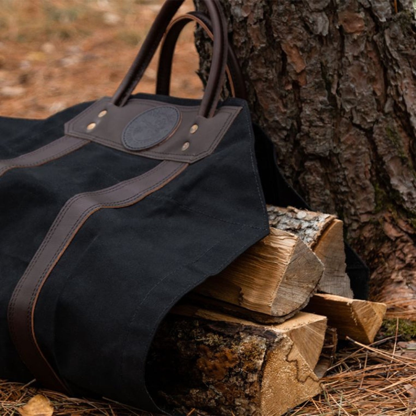 Durable log carrier made of heavy-duty fabric, designed for easily transporting firewood with sturdy handles for added convenience.