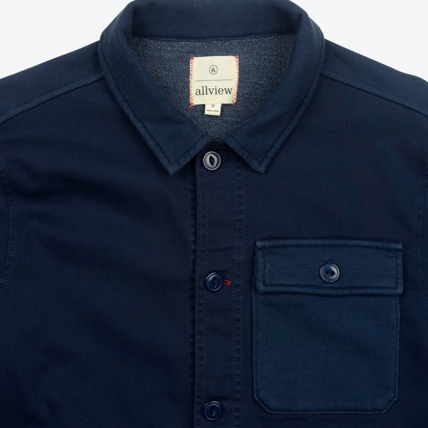 Navy blue button-down jacket with three pockets, casual outerwear for men.