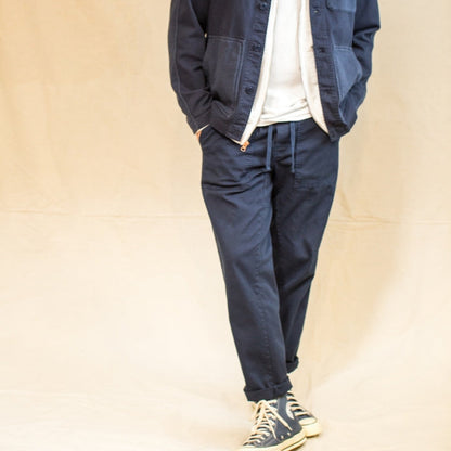 Men's navy pants with multiple pockets and a relaxed fit.