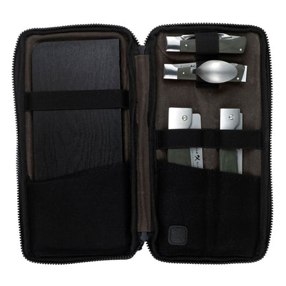 6-piece camping kitchen set, including pots, pans, and utensils, neatly arranged on a surface, designed for outdoor cooking