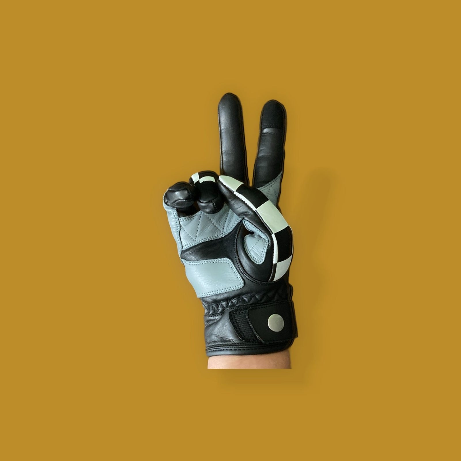 Retro checkered flag camouflage motorcycle gloves with bold design, perfect for riders seeking style and performance.