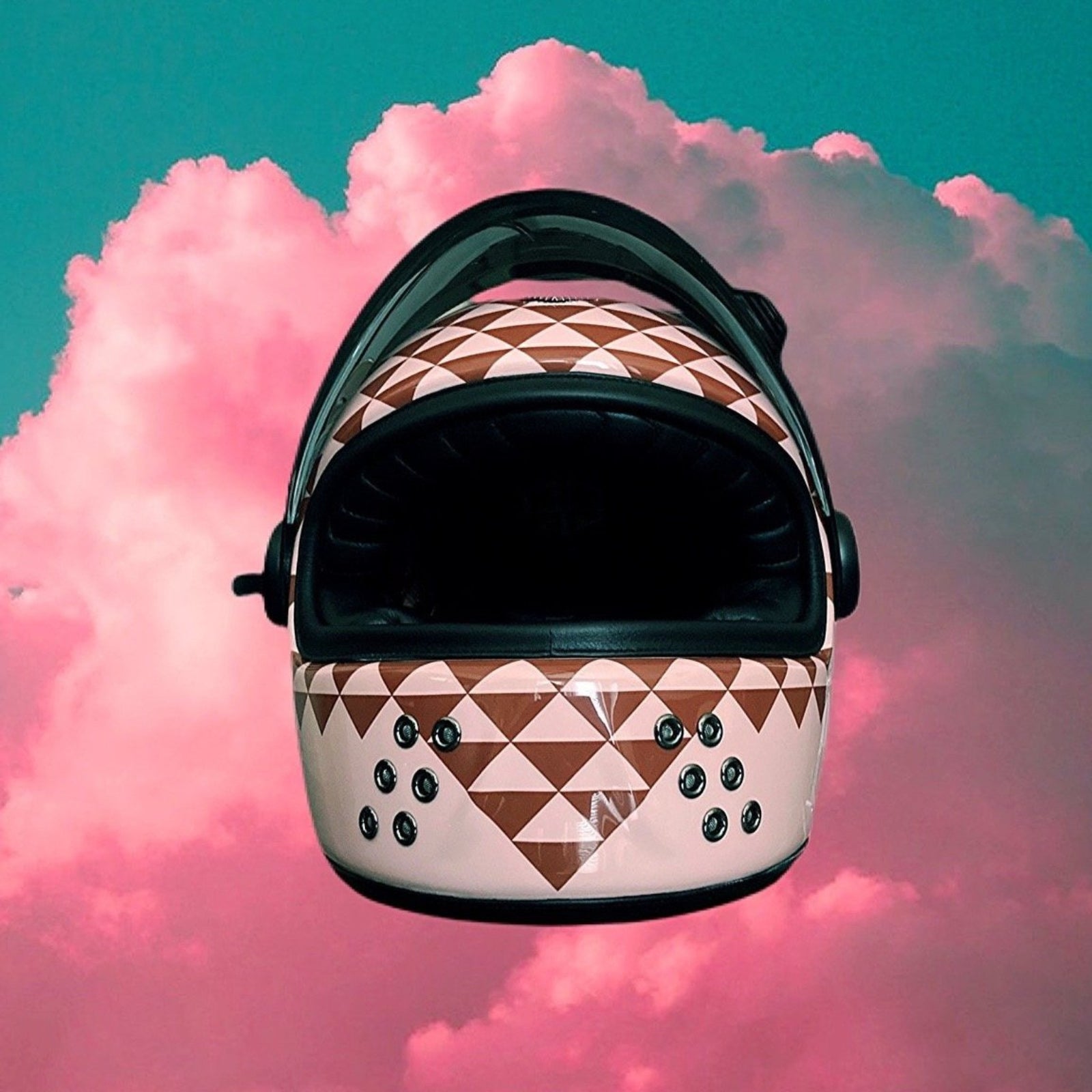 Retro Polynesian-inspired motorcycle helmet with bold tribal designs and vibrant colors, perfect for riders seeking unique style and protection.