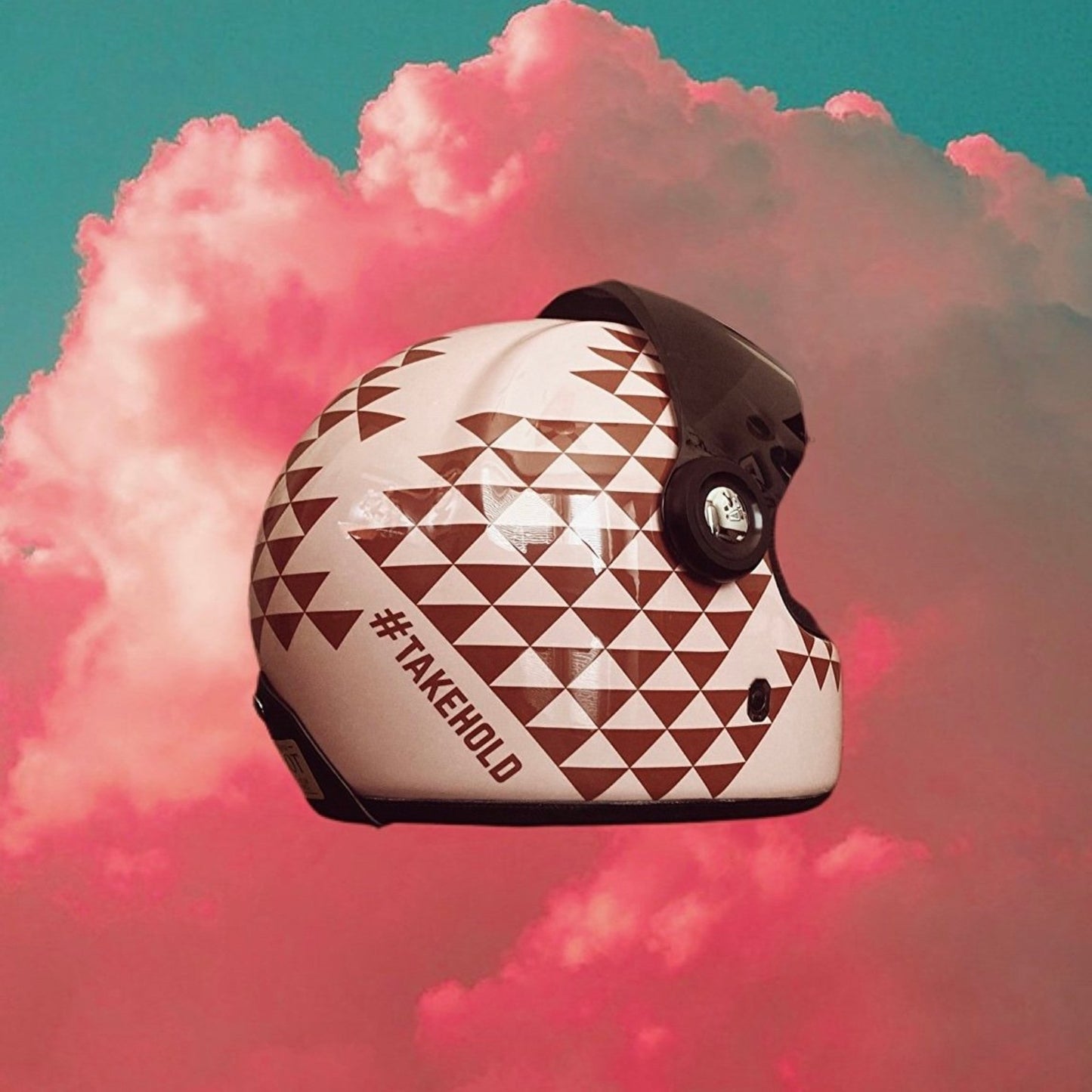 Retro Polynesian-inspired motorcycle helmet with bold tribal designs and vibrant colors, perfect for riders seeking unique style and protection.