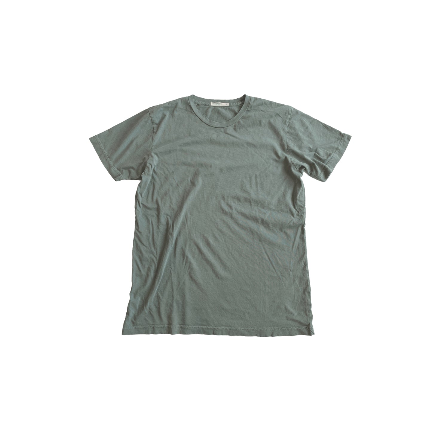 Sage colored ultra-soft jersey tee made in the USA, featuring a comfortable fit and high-quality fabric, perfect for everyday wear with a casual, relaxed style.