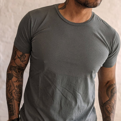 Sage colored ultra-soft jersey tee made in the USA, featuring a comfortable fit and high-quality fabric, perfect for everyday wear with a casual, relaxed style.