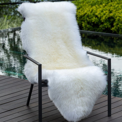 Soft and 100% natural sheepskin rug with natural, fluffy texture, showcasing premium quality craftsmanship and comfort for home decor.