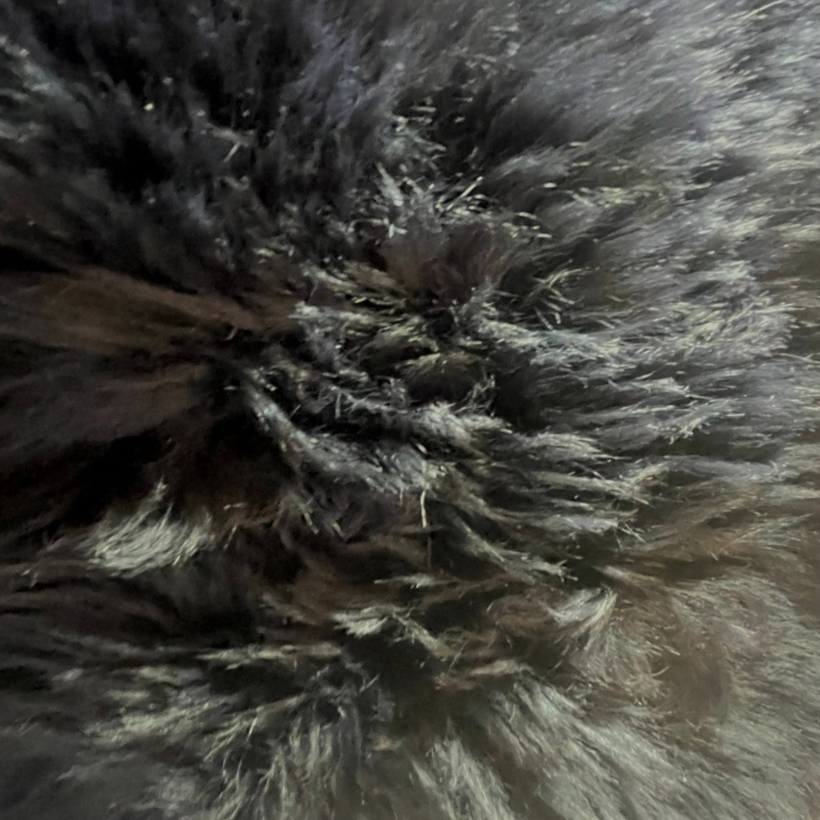 Soft and 100% natural sheepskin rug with natural, fluffy texture, showcasing premium quality craftsmanship and comfort for home decor.