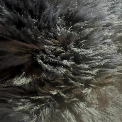 Soft and 100% natural sheepskin rug with natural, fluffy texture, showcasing premium quality craftsmanship and comfort for home decor.