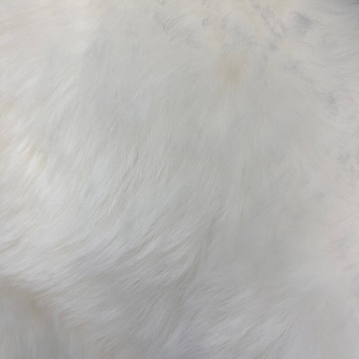 Soft and 100% natural sheepskin rug with natural, fluffy texture, showcasing premium quality craftsmanship and comfort for home decor.