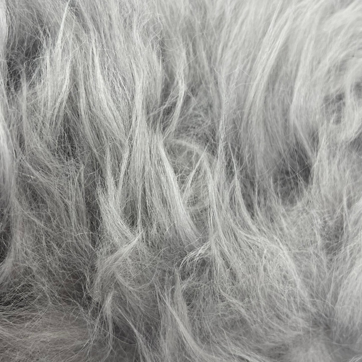 Soft and 100% natural sheepskin rug with natural, fluffy texture, showcasing premium quality craftsmanship and comfort for home decor.