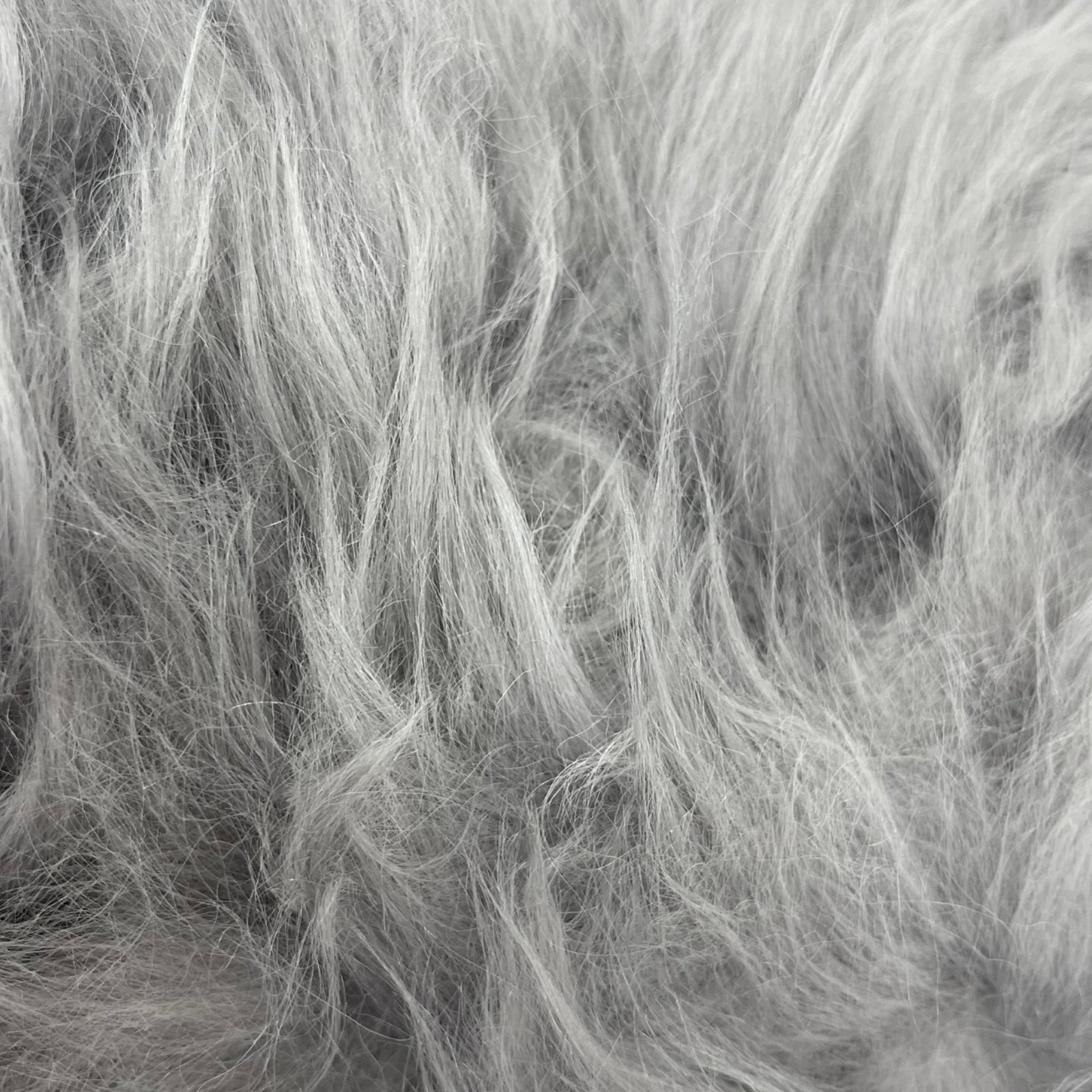 Soft and 100% natural sheepskin rug with natural, fluffy texture, showcasing premium quality craftsmanship and comfort for home decor.