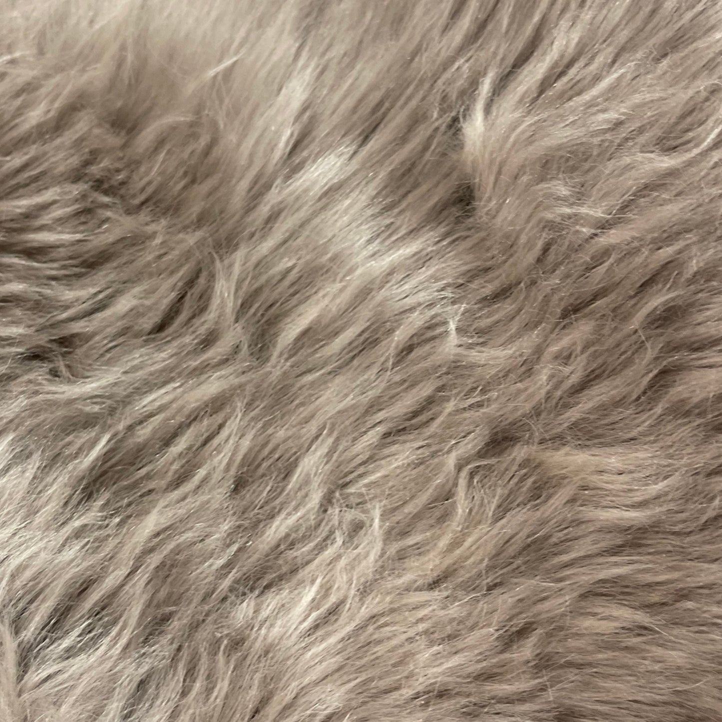 Soft and 100% natural sheepskin rug with natural, fluffy texture, showcasing premium quality craftsmanship and comfort for home decor.