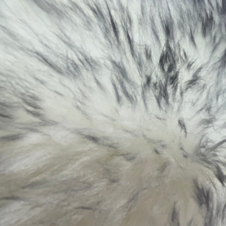 Soft and 100% natural sheepskin rug with natural, fluffy texture, showcasing premium quality craftsmanship and comfort for home decor.