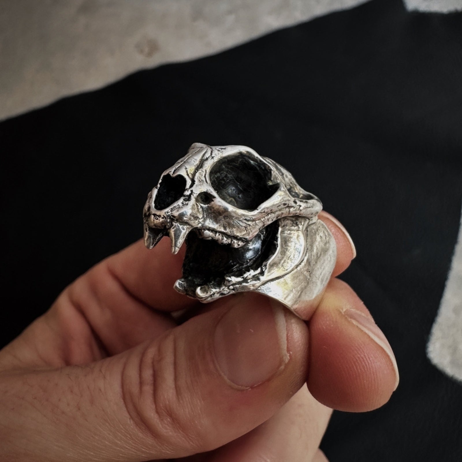 Intricate bobcat skull ring with detailed carving, showcasing a bold and unique animal-inspired design.