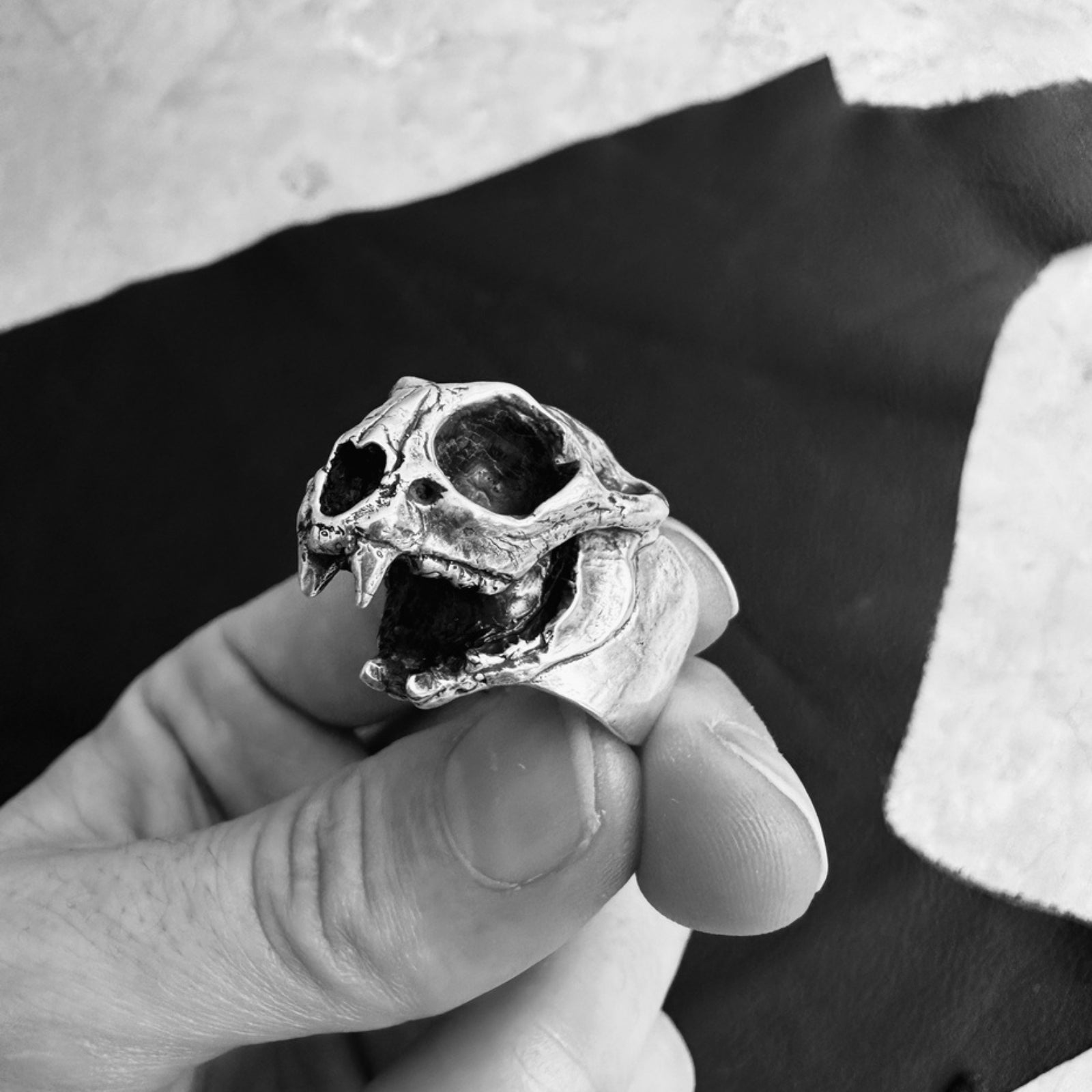 Intricate bobcat skull ring with detailed carving, showcasing a bold and unique animal-inspired design.